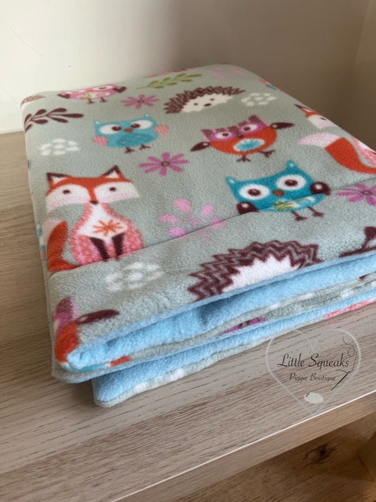 Soft, absorbent fleece bedding for guinea pigs with woodland design